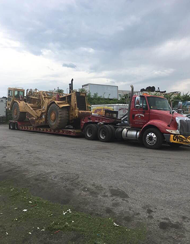 Truck Hauling a Large Construction Machine